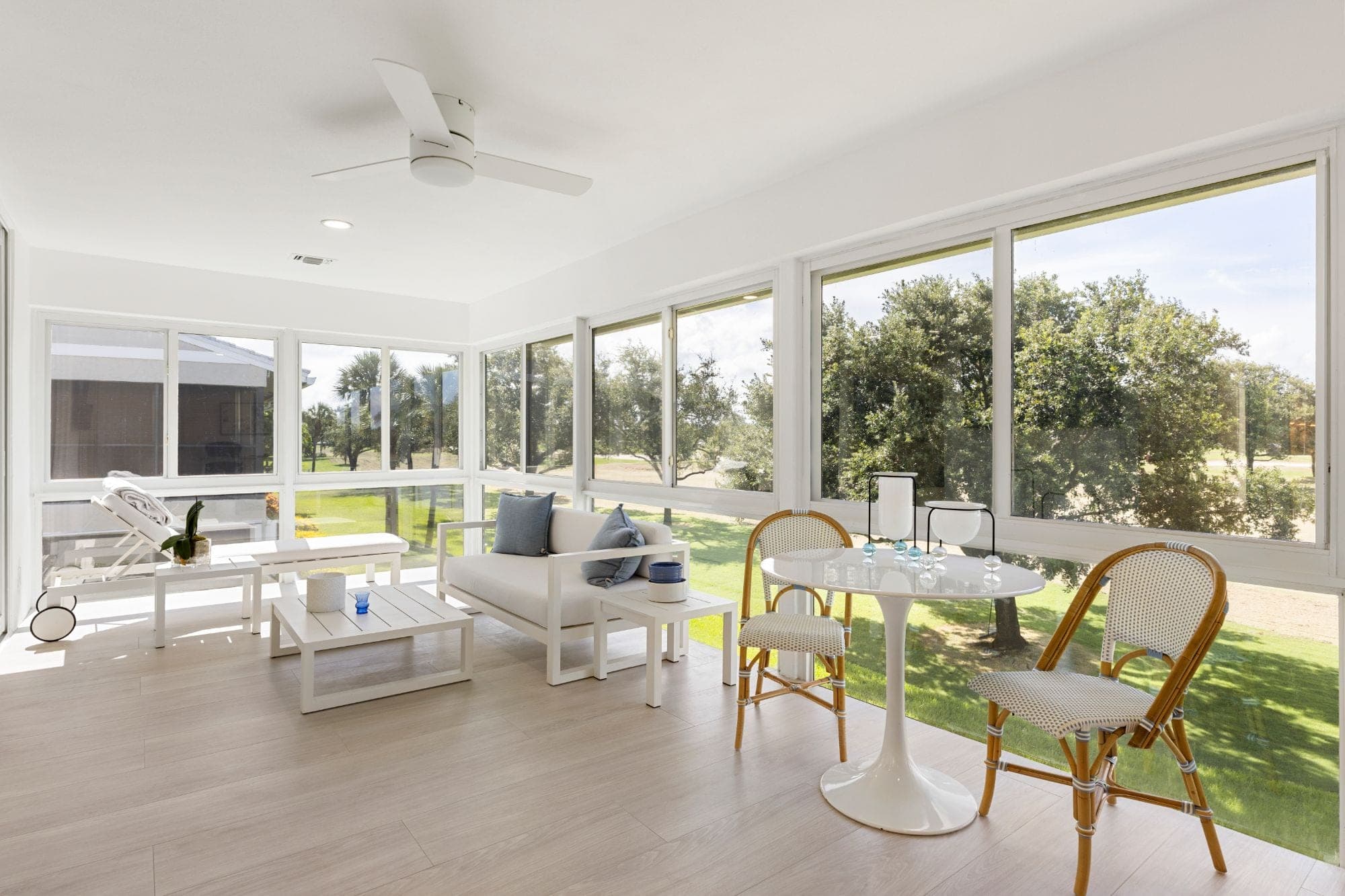 Sunlit sunroom with fairway views