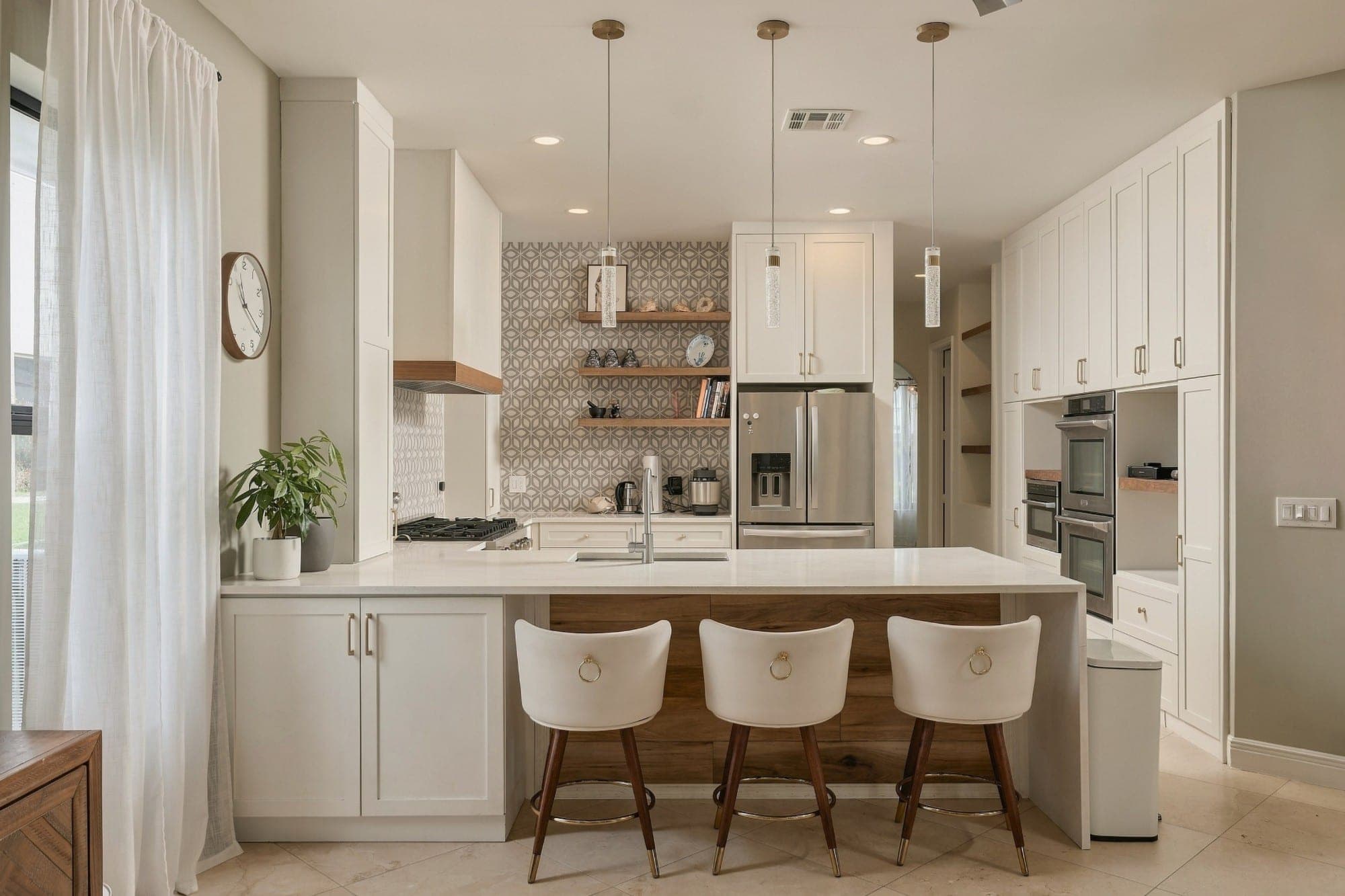 White shaker kitchen with a geometric tile backsplash